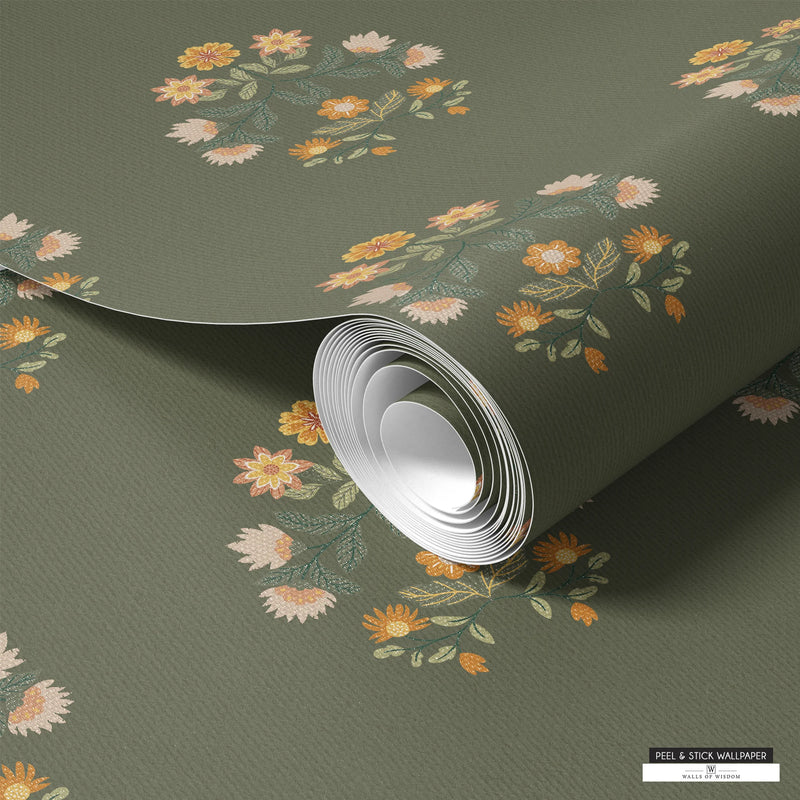 Country-style peelable wallpaper with floral block patterns in warm tones on a dark green background.