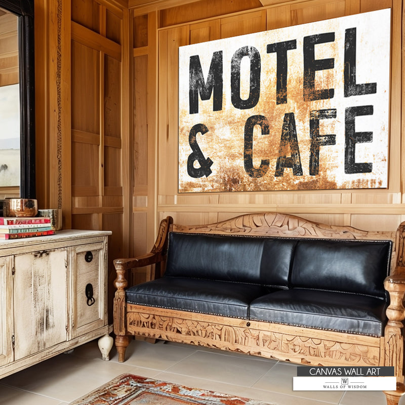 Rustic Motel & Cafe distressed canvas sign featuring vintage cowboy motel-style design in cream and black.